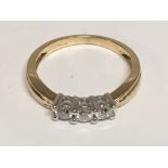 An 18carat gold ring set with three rose cut diamonds. Ring size O.