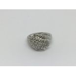 A 9ct white gold diamknd cluster ring set with baguette cut diamonds, approx 1ct, approx 4.7g and