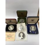 4 cased 1 ounce silver crowns and 1 1.5oz silver crown.