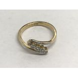 An 18ct gold ring set with five diamonds in a diagonal setting, approx.15ct, 3.6g and approx size