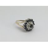A 9ct gold cluster ring set with diamonds and sapphires, approx 3.7g and approx size K.