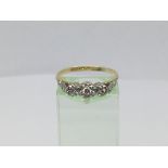A circa 1930s 18ct gold and platinum three stone diamond ring, approx 3.5g and approx size P-Q.
