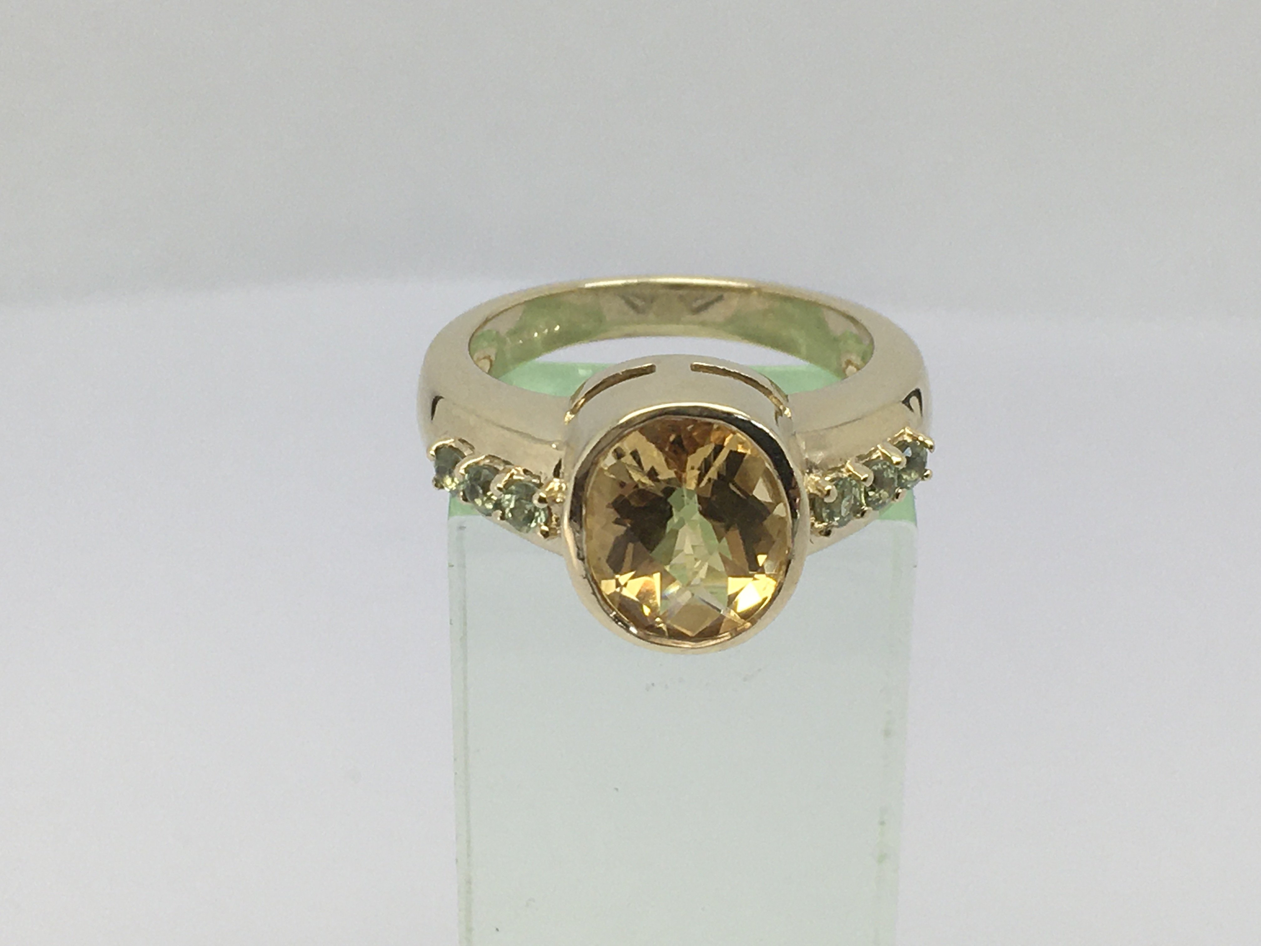 A 9ct gold dess ring set with topaz and citrine, approx 5.8g and approx size N-O.