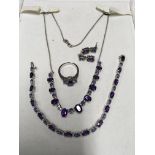 A 14ct white gold jewellery suite set with diamonds, amethyst and tanzanite comprising necklace,