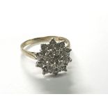 An 18carat yellow gold diamond cluster ring. Size P.