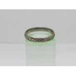 An unmarked white gold half eternity ring, possibly 18ct, set with diamonds, approx 3g and approx