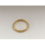 A 22 ct gold wedding band 2 grams.