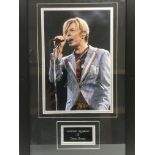 A framed and glazed signed photo display of David Bowie, approx 35cm x 55cm.
