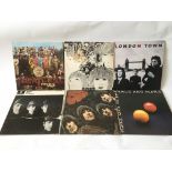 Four Beatles LPs plus two by Wings comprising 'Sgt Pepper', 'Revolver', 'Venus And Mars' and