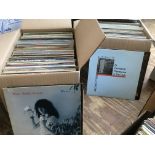 Two boxes of LPs by various artists including Patti Smith, OMD, Kate Bush and others.