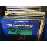 A collection of soundtrack LPs including 'The Music Lovers', 'War Of The Worlds', 'The Fastest