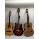 A Swift archtop acoustic guitar plus two classical guitars (both with soft carry cases) (3).