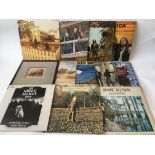 A collection of southern rock LPs by various artists including The Allman Brothers Band, America,