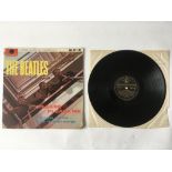 A first or second UK pressing of The Beatles debut LP 'Please Please Me' in mono with black and gold
