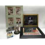 A collection of Beatles and related items comprising an Abbey Road picture mirror, a limited edition
