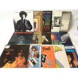 A collection of LPs by various artists including The Beatles, Jimi Hendrix, Ike & Tina Turner,