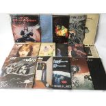 A collection of rock LPs by various artists including Jimi Hendrix, AC/DC, Thin Lizzy, Status Quo