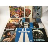 A collection of LPs by various artists including John Mayall, The Beatles, The Rolling Stones,