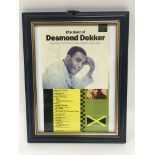 A framed and glazed signed Desmond Dekker CD cover display, approx 18.5cm x 23.5cm.