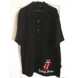 A Rolling Stones short sleeve shirt in black with 'lips' logo and the same on the buttons, size