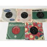 A 1962 pressing of 'Love Me Do' b/w 'P.S. I Love You' plus four other 7inch singles by The Beatles.