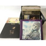 A collection of Elton John LPs and a book comprising 'Empty Sky', 'Goodbye Yellow Brick Road' and