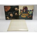 Three early issue Beatles LPs including a numbered 'White Album' no.0403944 complete with black
