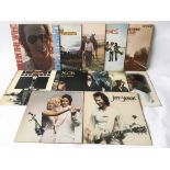 A collection of Country Rock LPs by various artists including John Stewart, Waylon Jennings, Woody