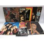 Nine LPs and a 7 inch single by various artists including The Rolling Stones, Santana, Bob Marley