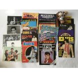A collection of Elvis Presley memorabilia including press publicity photos.