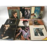 A collection of LPs by various artists including Rod Stewart, Otis Redding, Stevie Wonder and