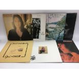 A collection of female folk and singer songwriter LPs by various artists including Joni Mitchell,
