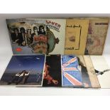A collection of singer songwriter LPs by various artists including Elton John, Joni Mitchell, John