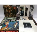 A collection of 24 Bob Dylan and related LPs including 'Highway 61 Revisited', 'Desire', 'The