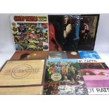 A collection of LPs by various artists from the 1960s including The Beatles, Jimi Hendrix, Big