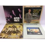 Four LPs comprising 'Aftermath' by The Rolling Stones, 'That'll Be The Day' by Buddy Holly, 'Hollies