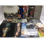 A collection of 1970s rock LPs by various artists including The Kinks, Blood Sweat & Tears, Rush,