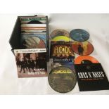 A record box of 7inch singles by various artists including The Beatles, T Rex, Guns n Roses, AC DC