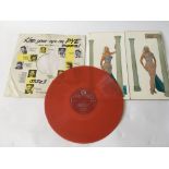 A collectable Diana Dors LP 'Swingin Dors' on red vinyl. Vinyl has light surface and spindle marks.