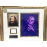 A framed and glazed signed photo display of Bob Marley with COA, approx 50.5cm x 43cm.