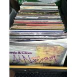 A collection of LPs comprising many compilations and comedy titles.