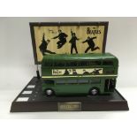 A Beatles route master novelty telephone.