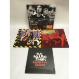 Four Rolling Stones vinyl records comprising 'Totally Stripped' (DVD and 2LP set), 'Dirty Work'
