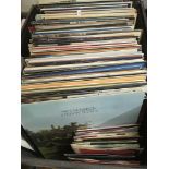 A large box containing LPs and 7inch singles by various artists including Van Morrison, Leonard