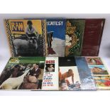A collection of various rock and pop LPs by various artists including The Beach Boys, Love, Roy
