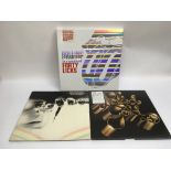 A limited edition CD box set of 'Forty Licks' by The Rolling Stones together with two vinyl LP