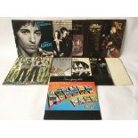 A collection of rock and folk rock LPs by various artists including Bruce Springsteen, The Byrds,