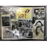 A collection of film star photographic portraits, some signed, together with two lobby cards.