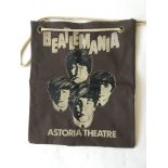A canvas bag printed with images of The Beatles and bearing the words 'Beatlemania Astoria