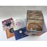 A box of 7 inch singles from the 1950s and 60s by various artists including Buddy Holly, Traffic,